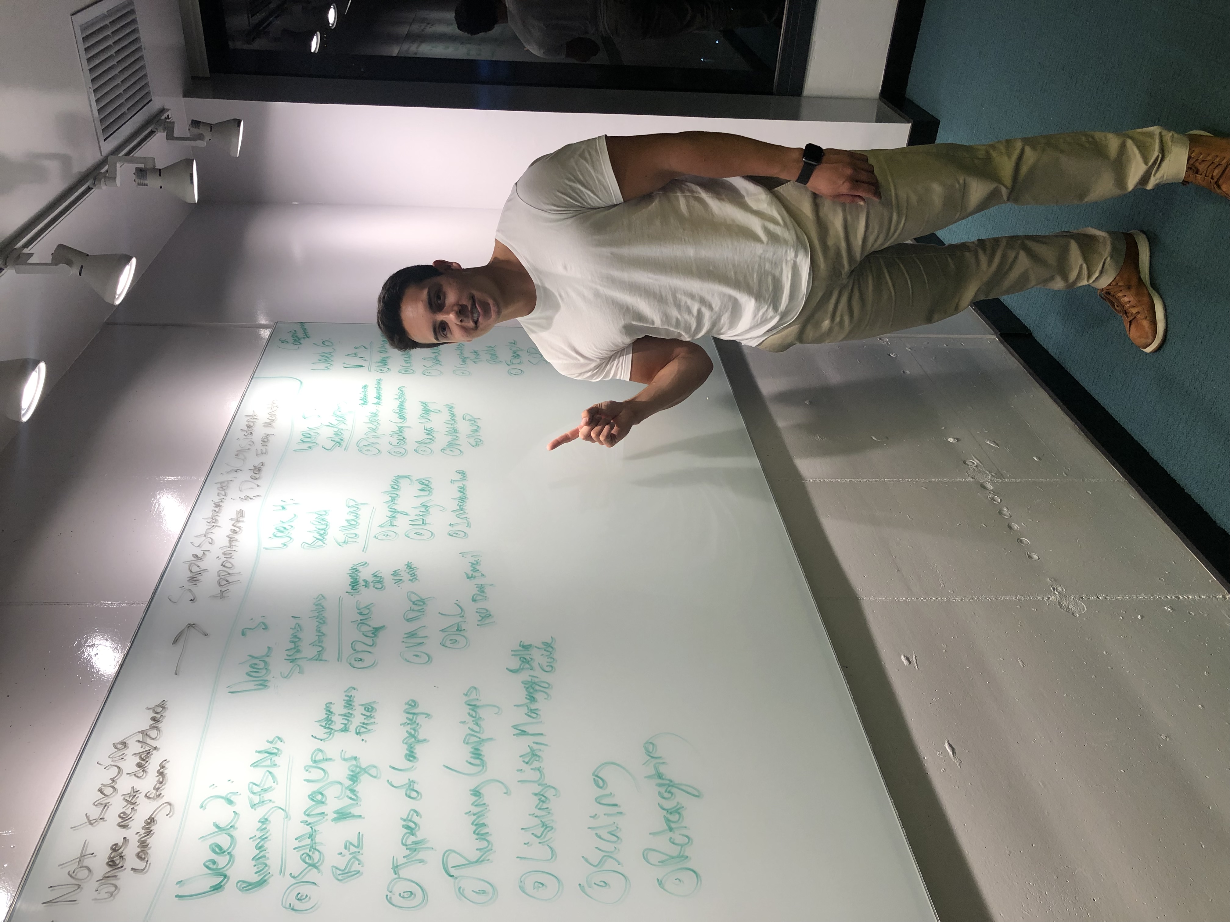 Ravi Abuvala mapping out Scaling With Systems on a whiteboard in Medellín, Colombia — 2019
